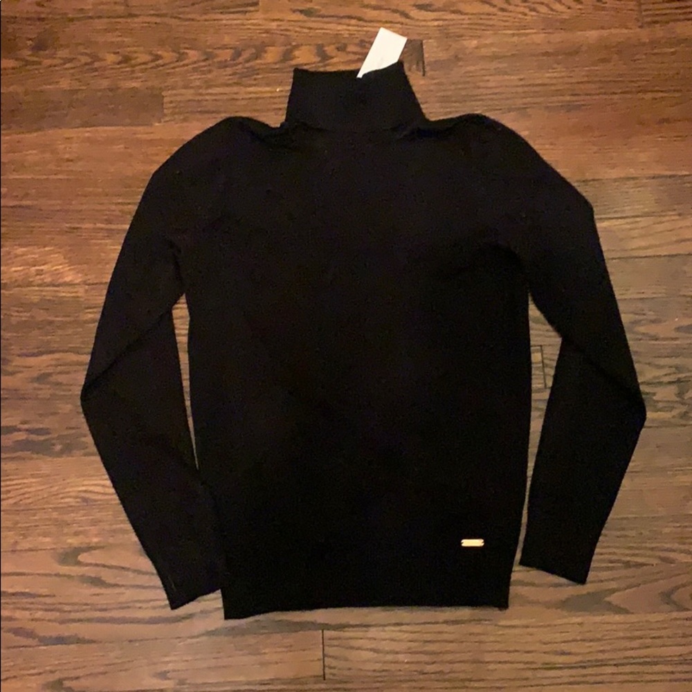 Black Calvin Klein turtleneck sweater
